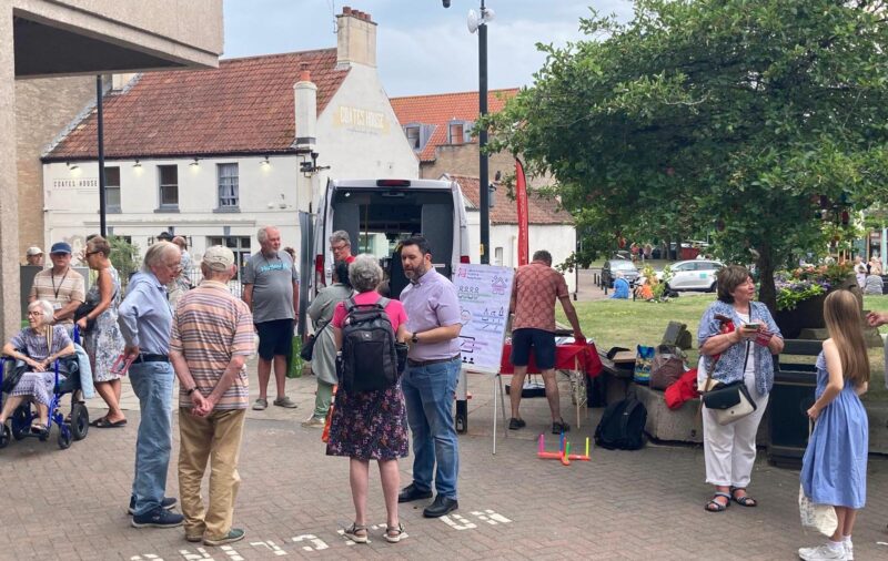 North Somerset Labour Party volunteers and Sadik Al-Hassan MP engaging with passers-by at their stall at Nailsea Market on Saturday 21st June.
