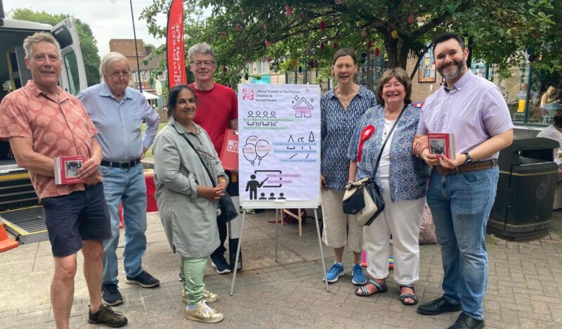 North Somerset Labour Party volunteers, Cllr Clare Hunt (second from right), and Sadik Al-Hassan MP (right) running their stall at Nailsea Market on Saturday 21st June.